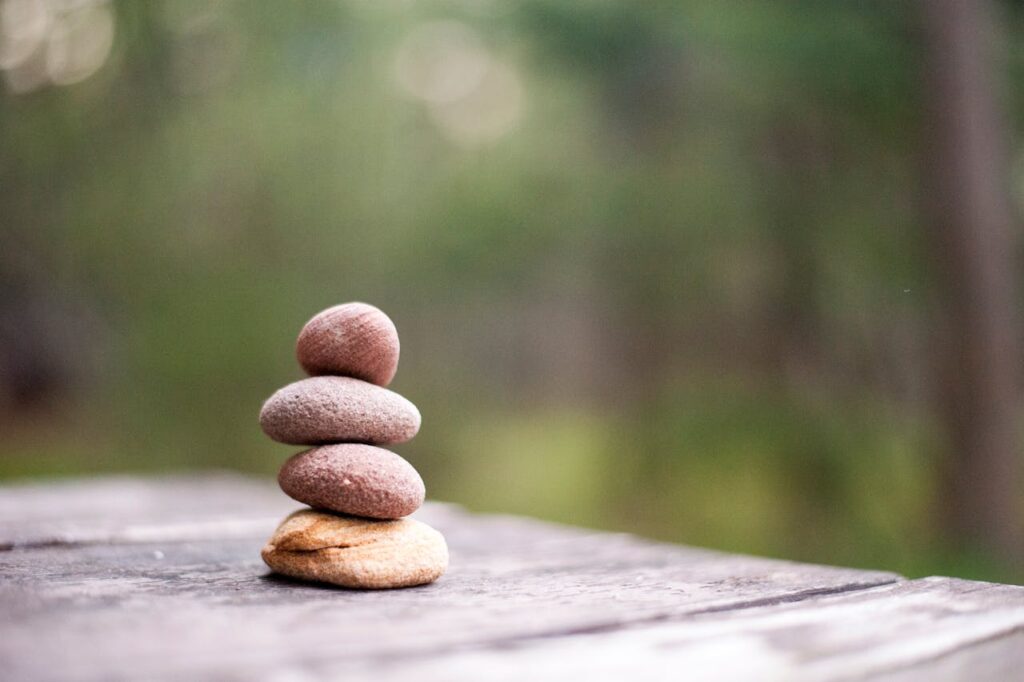 Stacked rocks on a wooden table.